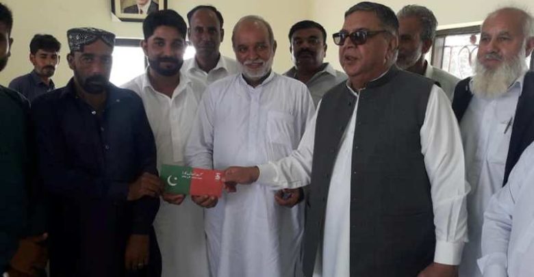 Kallar Syedan; Ch M Azeem and Raja Sajid Javed (PTI) distribute Insaaf health cards at UC Choa Khalsa